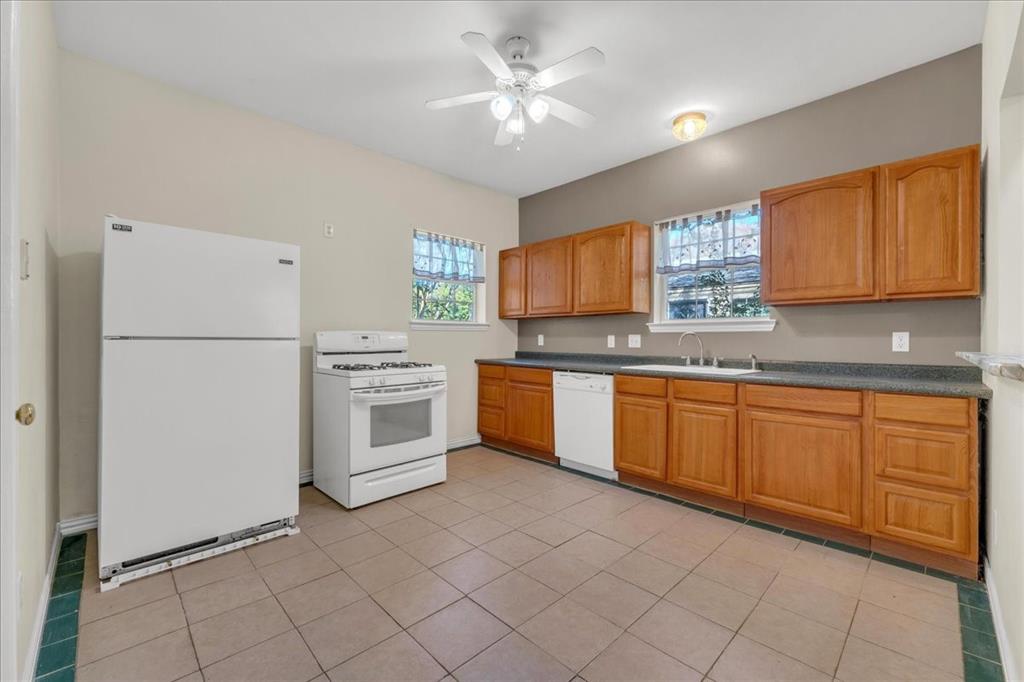 Back unit kitchen with enough space for eat in kitchen or an island.