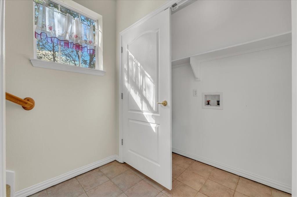 Laundry hookup at the bottom of stairs in back unit.
