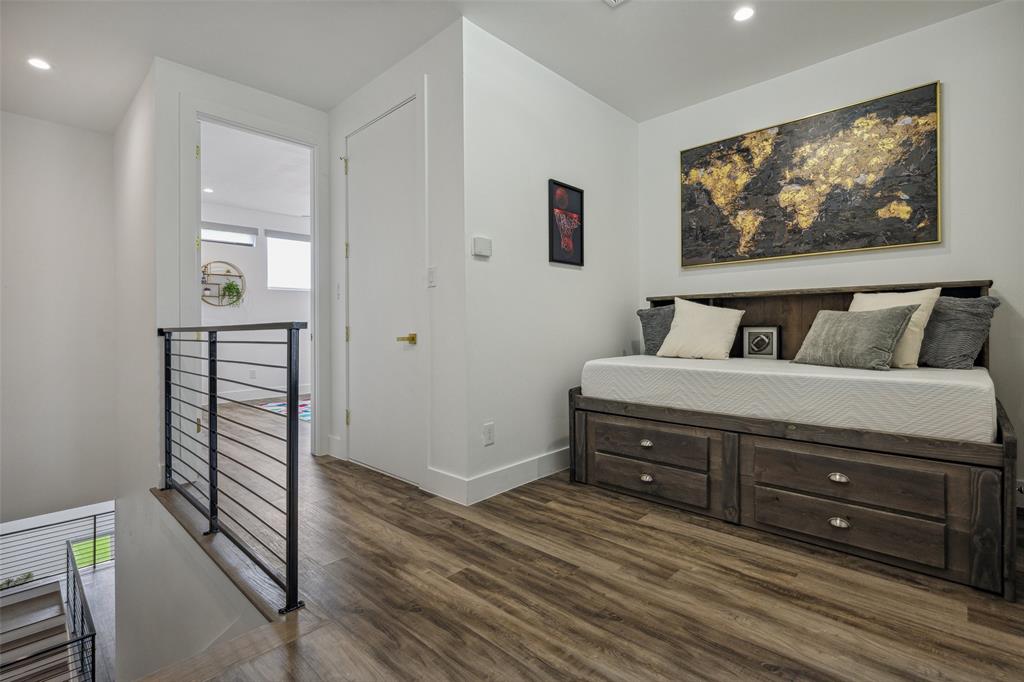 Bedroom with dark wood-type flooring