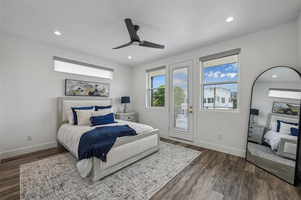 Bedroom with ceiling fan, access to exterior, and hardwood / wood-style flooring