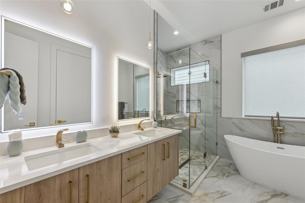 Bathroom with plus walk in shower, tile patterned flooring, and vanity