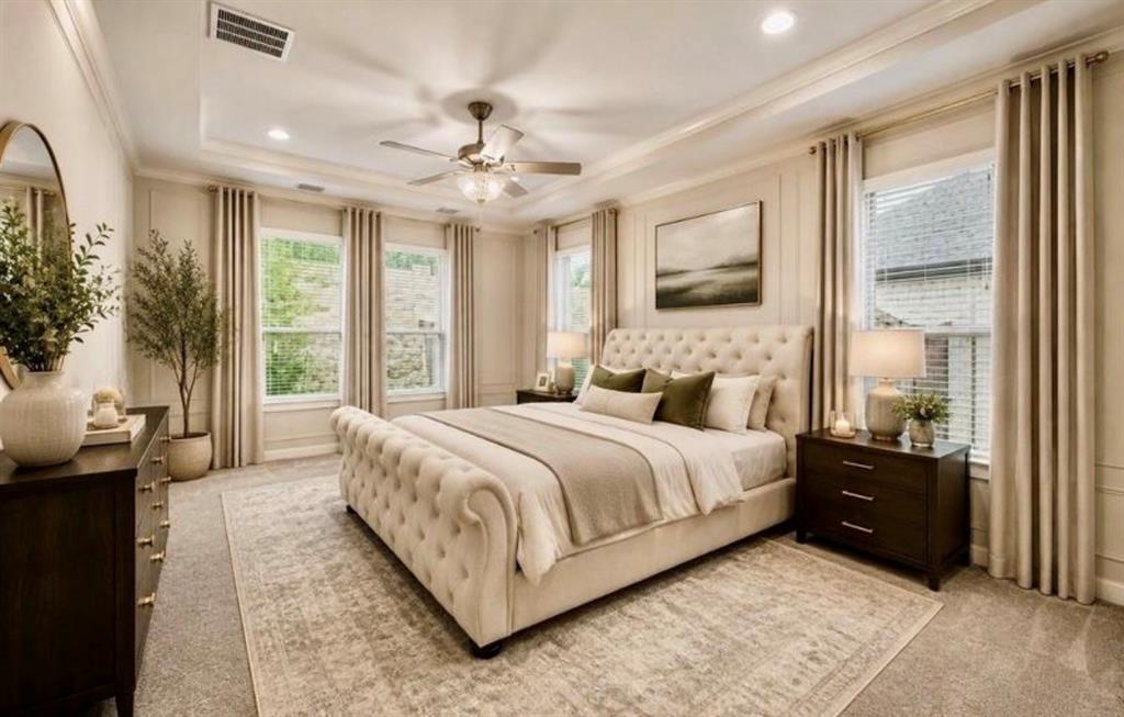 Tray ceiling with recessed lighting, crown molding, wall paneling, and ceiling fan with integrated light fixture