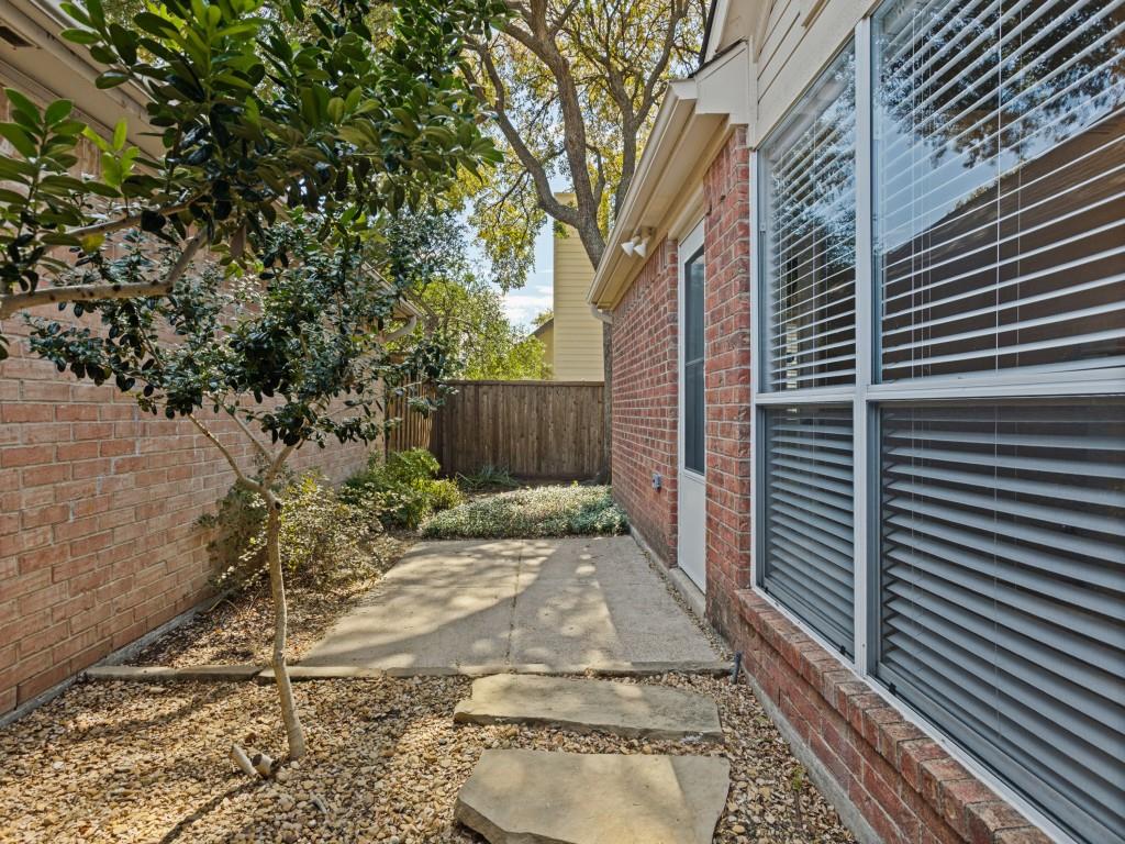 Patio with access to front sidewalk to driveway