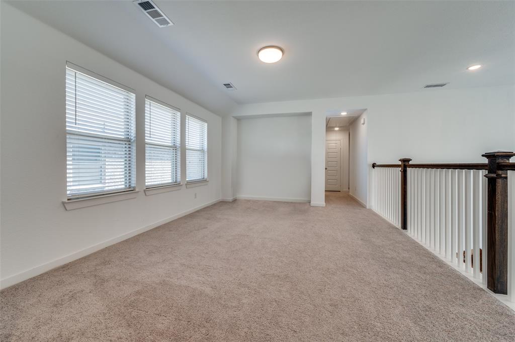 Carpeted spare room featuring baseboards and recessed lighting