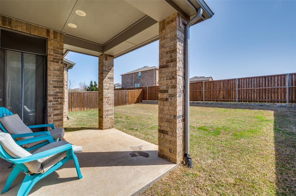 Fenced backyard featuring a patio area