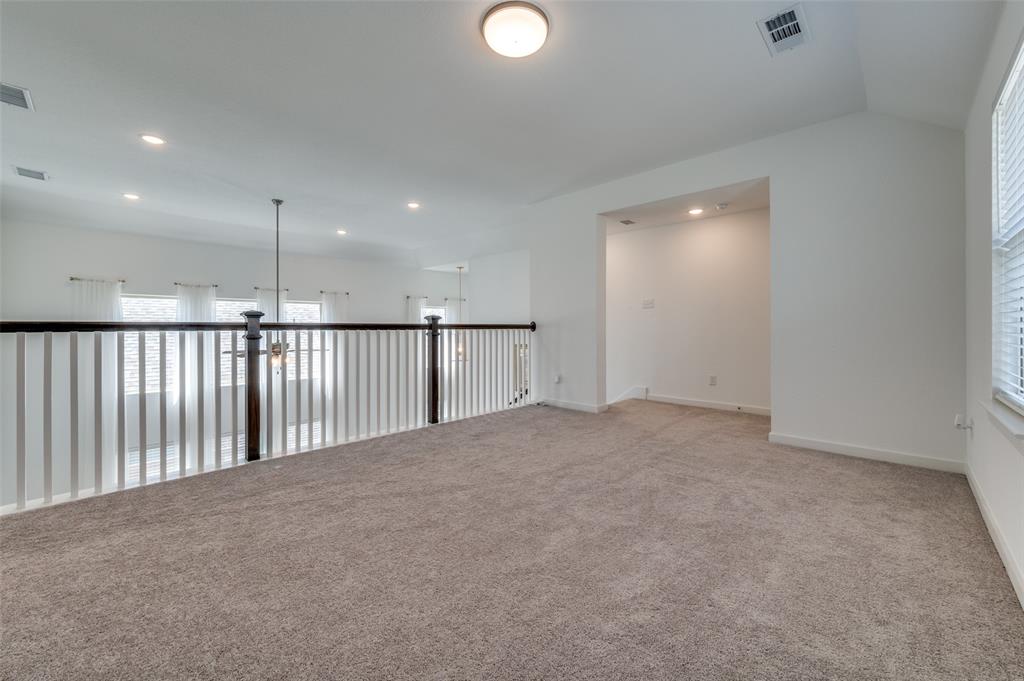 Spare room featuring light carpet and recessed lighting