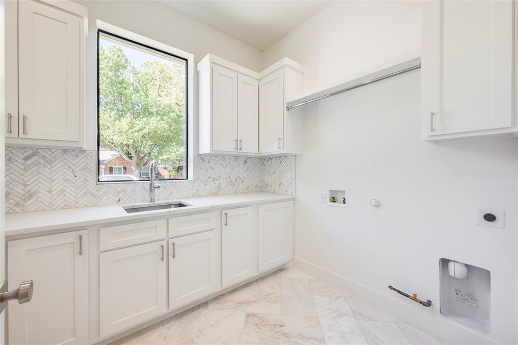Natural light, marble floors, sink and lots of cabinetry!