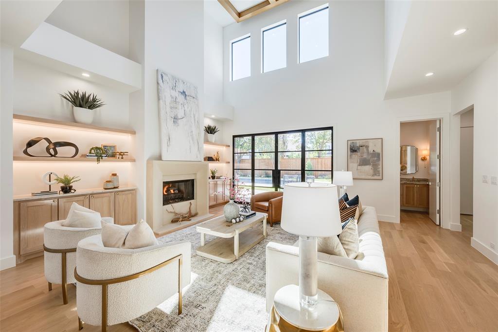 20' ceilings, gorgeous built-ins, gas log fireplace and views of the patio & pool!