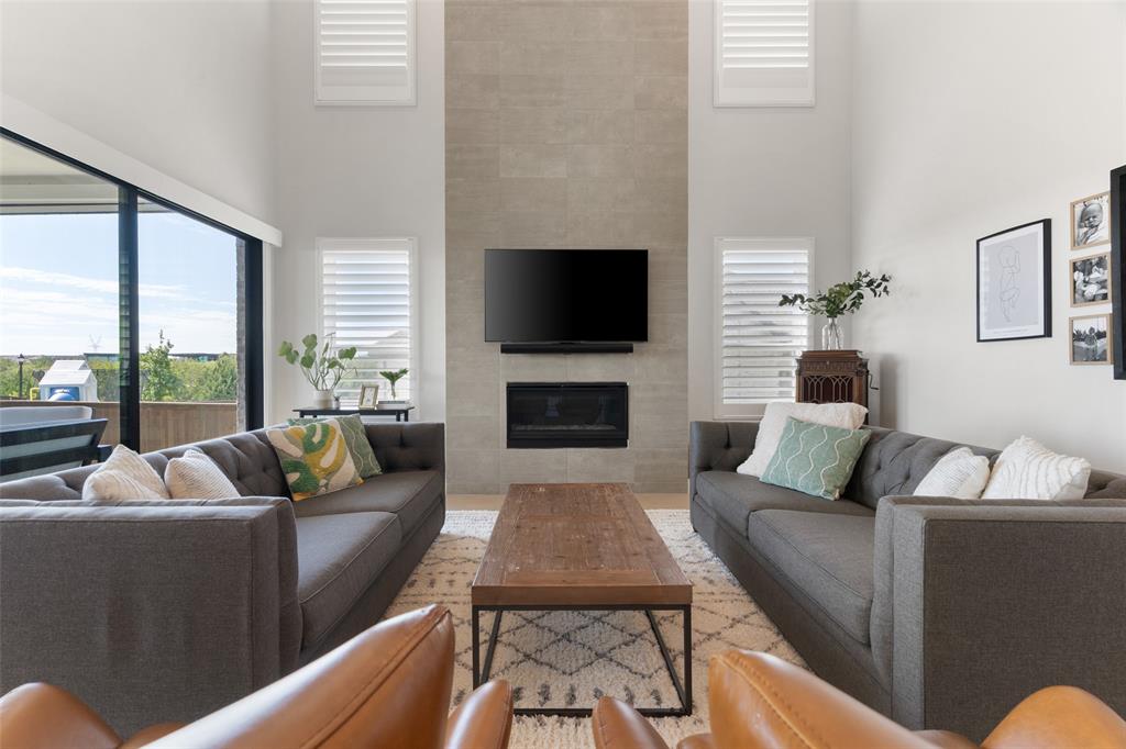 Living Room with dramatic floor to ceiling fireplace