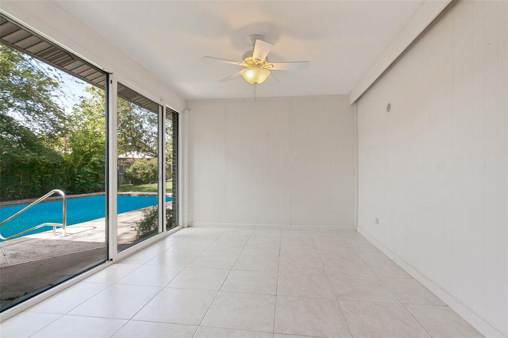 Large breakfast area overlooking backyard space w pool.