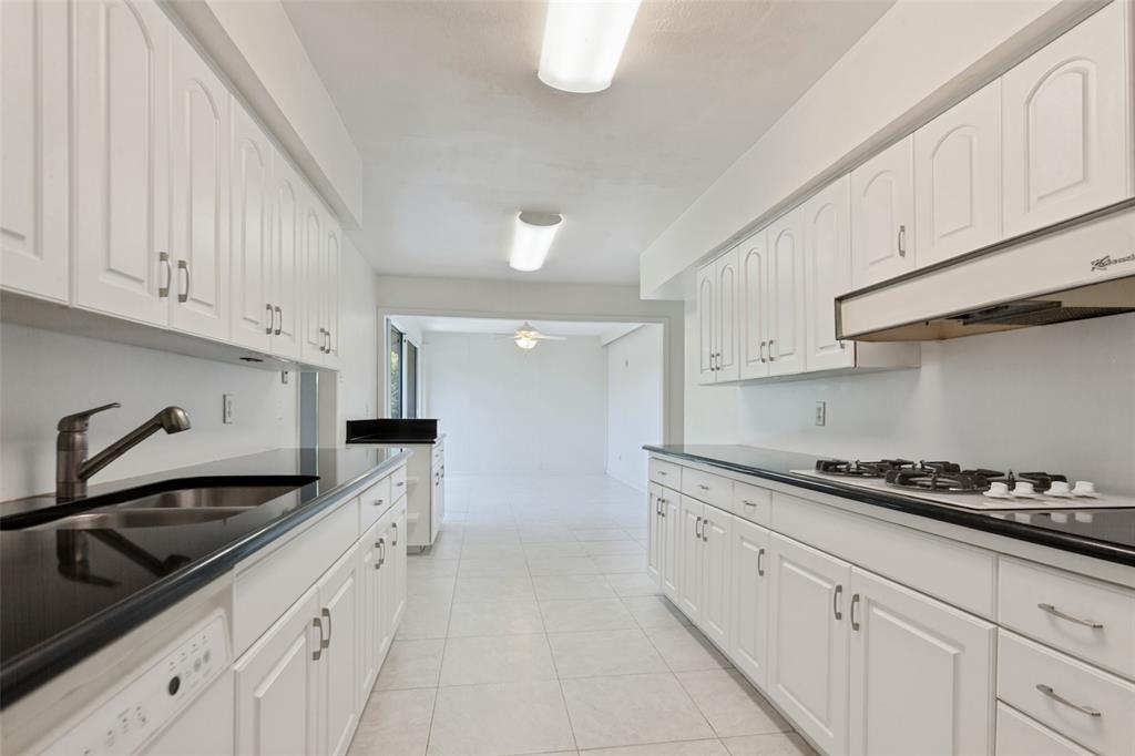 Galley kitchen with lots of storage.