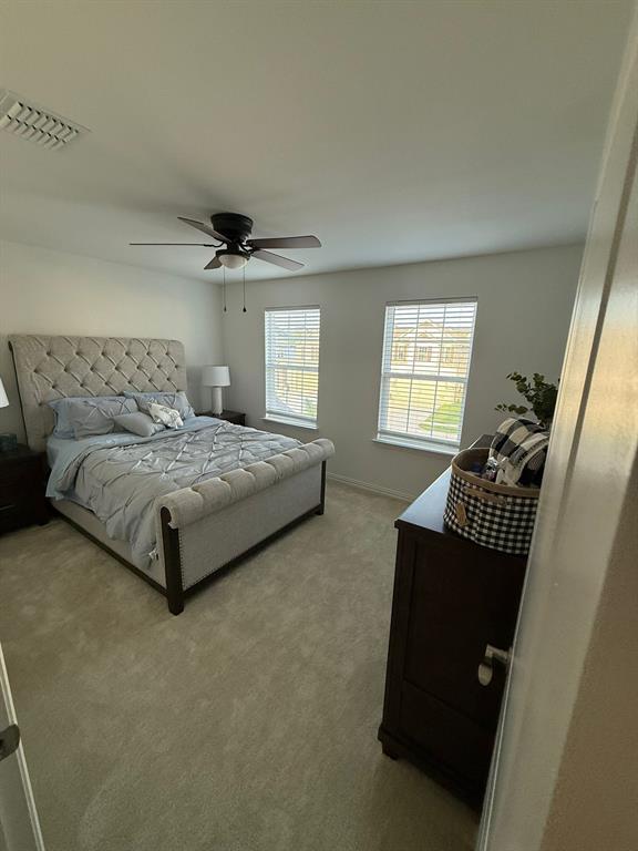 Bedroom featuring carpet flooring and ceiling fan