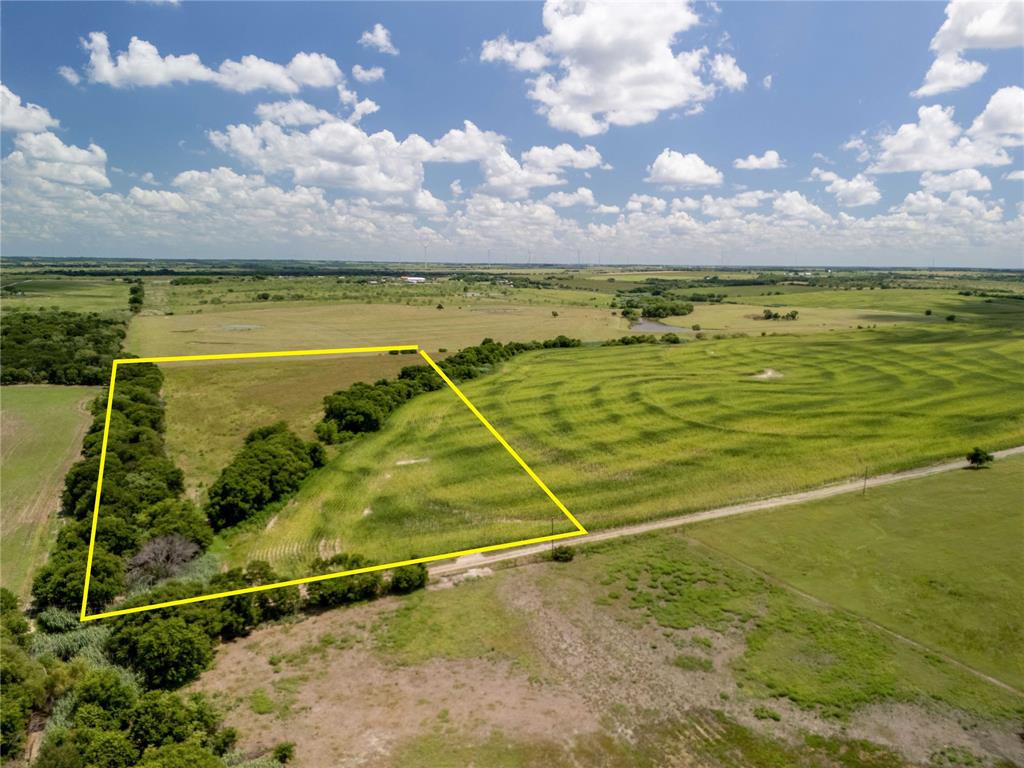 Aerial view of sparsely populated area with property boundaries highlighted