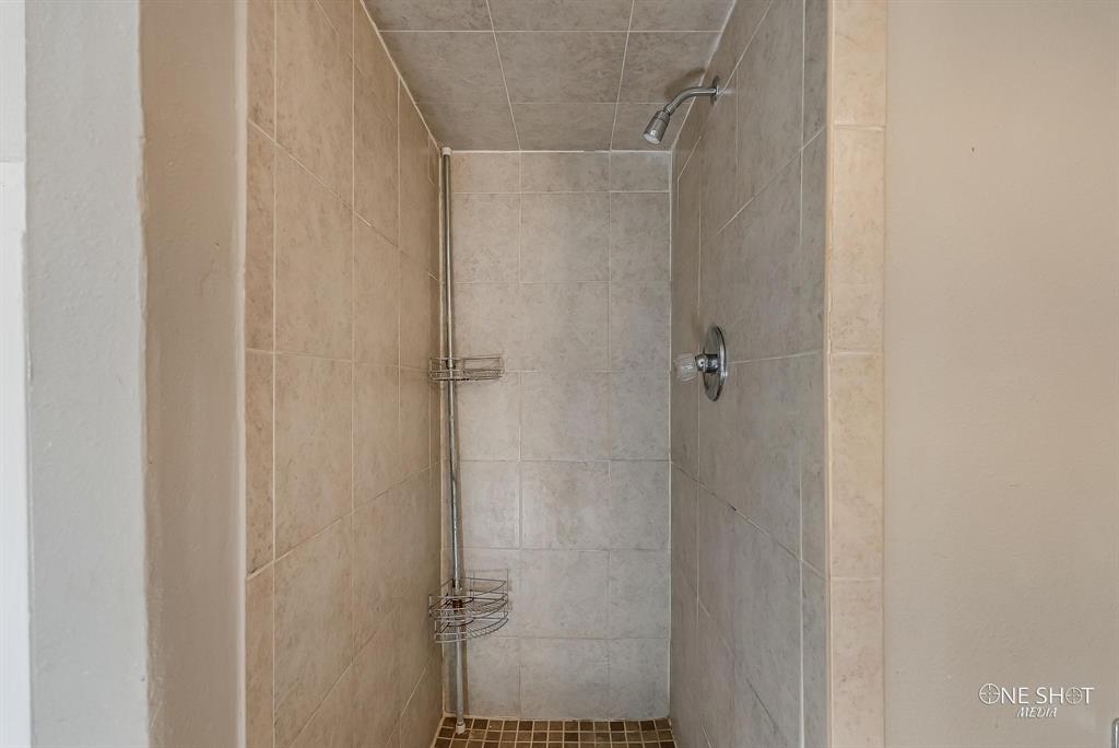 Bathroom with a tile shower