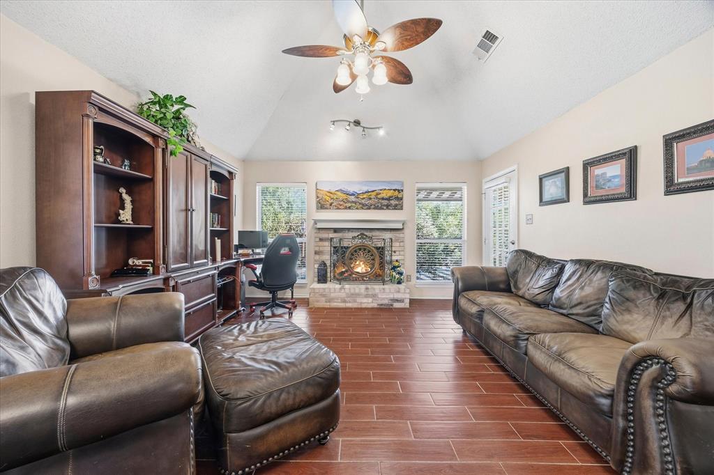 Family room includes gorgeous fireplace
