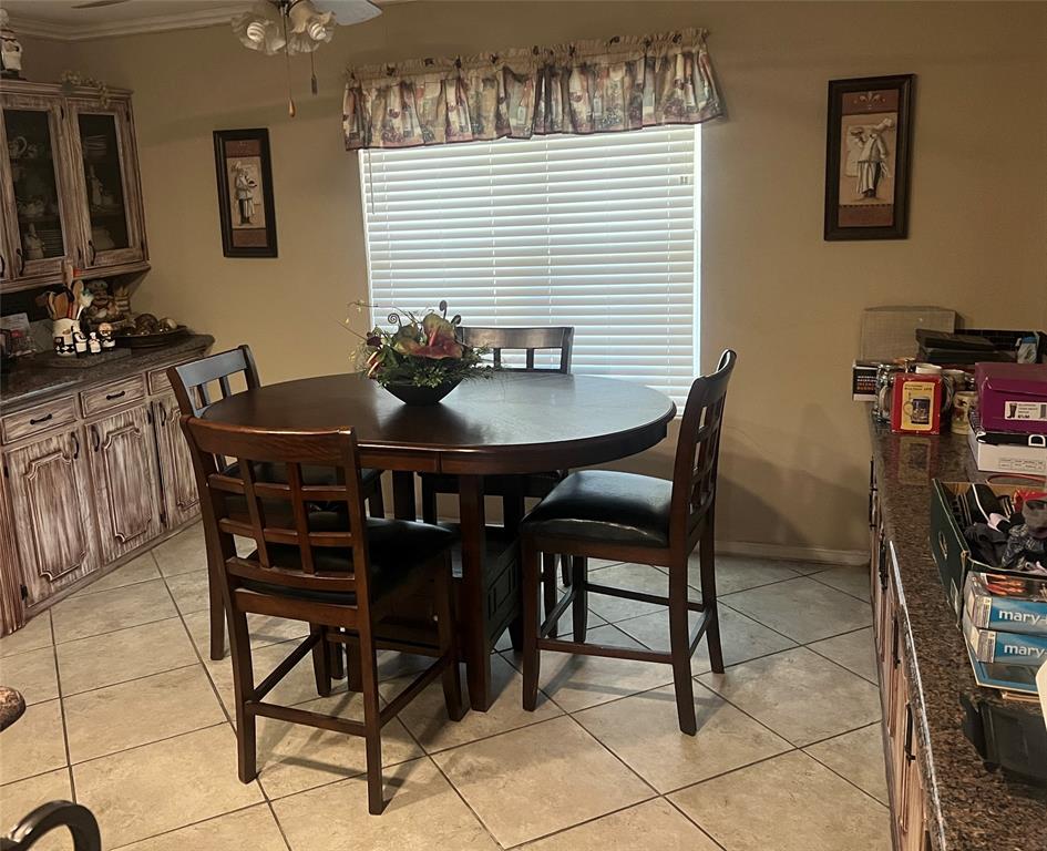 Large dining area  at one end of kithcen. Tons of storage
