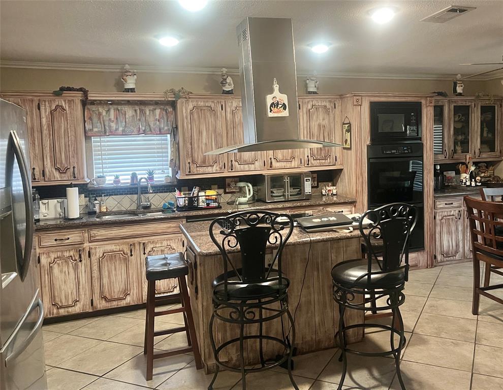 Kitchen has center island, built in hutch.