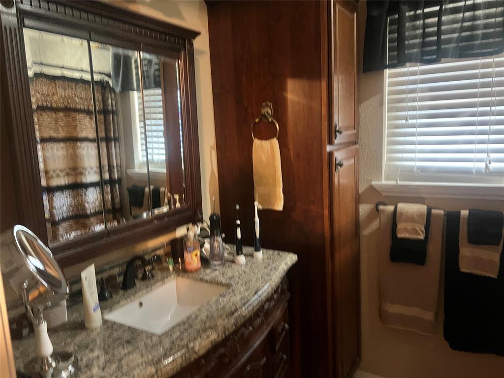 Master bath has a custom vanity with granite top.