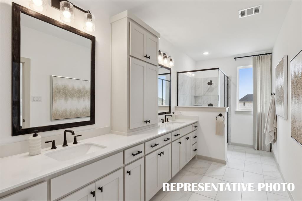 Filled with style, sophistication and space, this fantastic owner's bath was built for two!  REPRESENTATIVE PHOTO