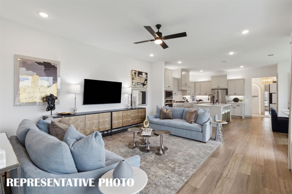 The open and flowing main level in our Madeleine plan make this the perfect family home. REPRESENTATIVE PHOTO The open and flowing main level in our Madeleine plan make this the perfect family home. REPRESENTATIVE PHOTO