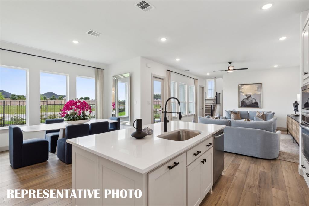 With the kitchen open to the dining and family rooms, the chef in the family will never be left out of the party! REPRESENTATIVE PHOTO With the kitchen open to the dining and family rooms, the chef in the family will never be left out of the party! REPRESENTATIVE PHOTO