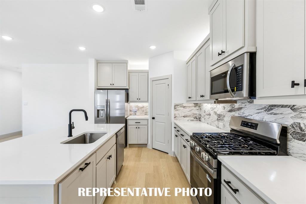 Beautiful cabinetry, gorgeous counter tops and classic backsplash effortlessly pair with contemporary stainless steel to create a kitchen for the ages! REPRESENTATIVE PHOTO Beautiful cabinetry, gorgeous counter tops and classic backsplash effortlessly pair with contemporary stainless steel to create a kitchen for the ages! REPRESENTATIVE PHOTO