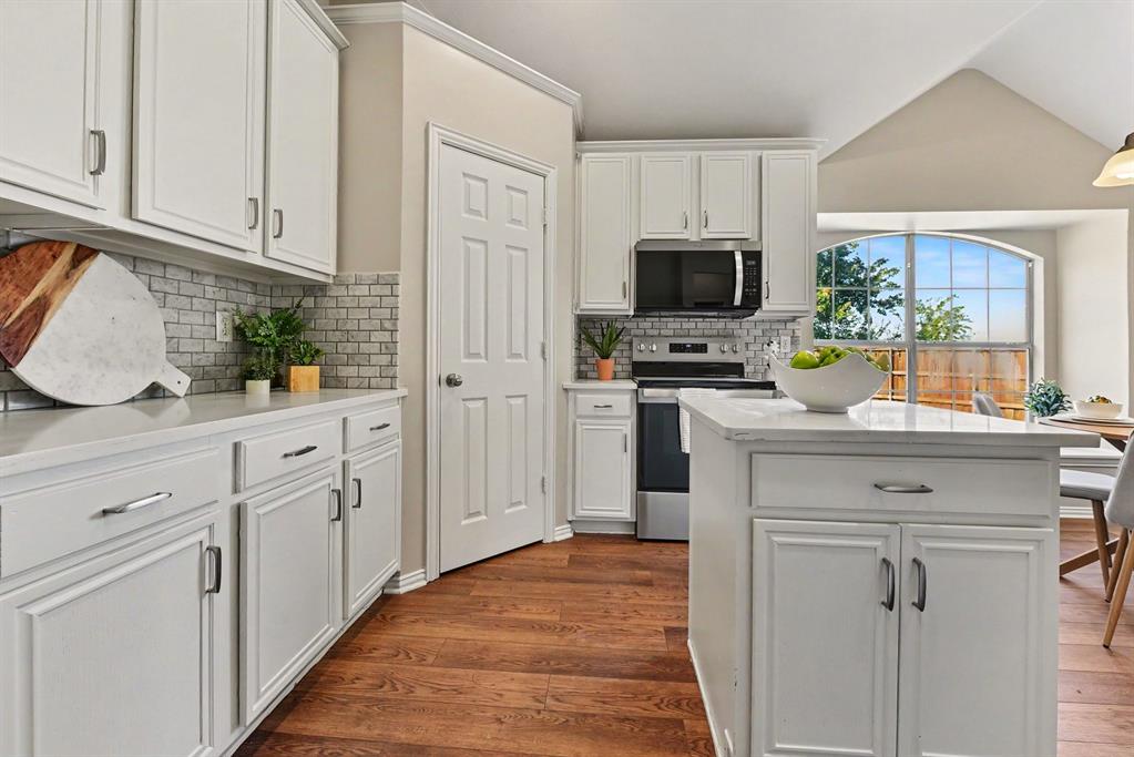 Kitchen with quartz counters and subway tile backsplash