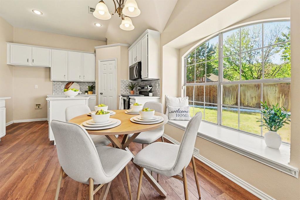 Breakfast room looks out into backyard