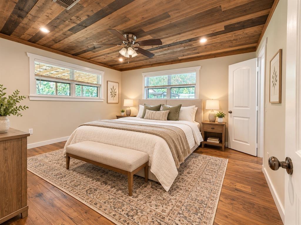Planked wood ceiling featuring multi-tonal finishes, wood-finish flooring, recessed lighting, and a multi-blade ceiling fan with an integrated light fixture