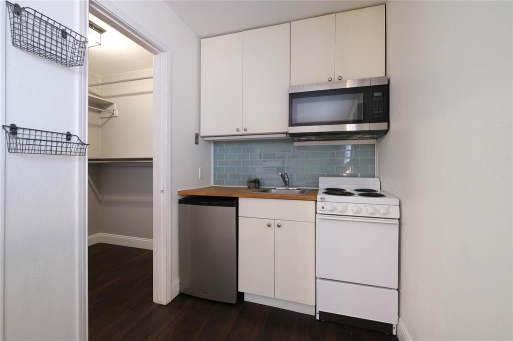 Kitchen equipped with dishwasher, oven, range, microwave, and full size refrigerator will be made available downstairs. Baskets installed on wall for additional storage Kitchen equipped with dishwasher, oven, range, microwave, and full size refrigerator will be made available downstairs. Baskets installed on wall for additional storage