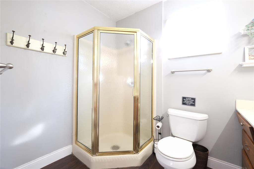 Stand in shower with hooks for towels or robes