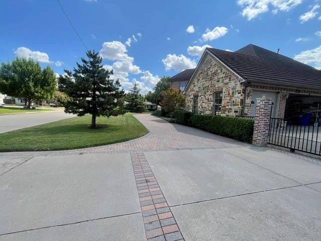 Circular driveway and gated driveway to garage