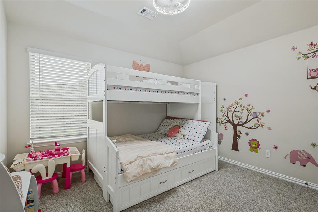 Vaulted ceiling, neutral wall tones, wall-to-wall carpeting, and horizontal slat window blinds