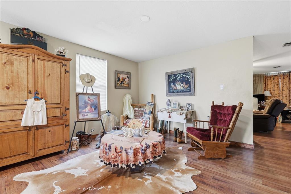 Wood-finish flooring throughout the space with neutral wall coloring