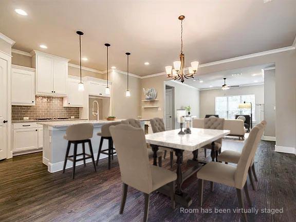 Kitchen featuring white cabinetry, subway tile backsplash, stone-finish countertops, recessed lighting, and wood-finish flooring