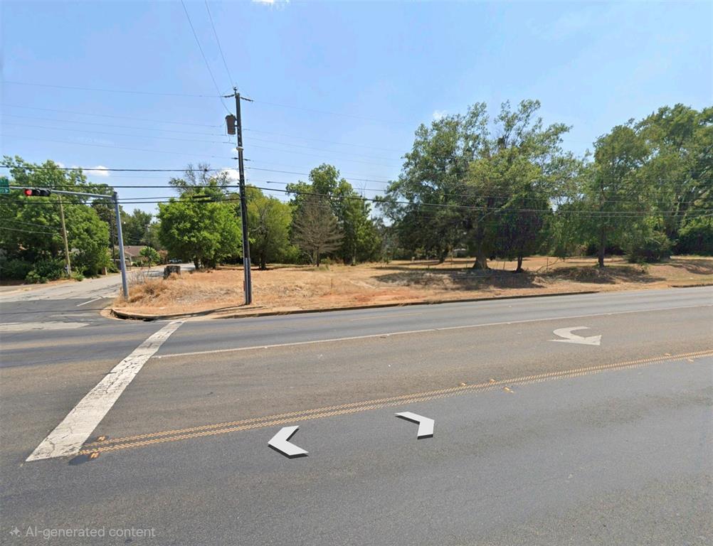 Corner lot featuring mature trees and level topography with street-level accessibility