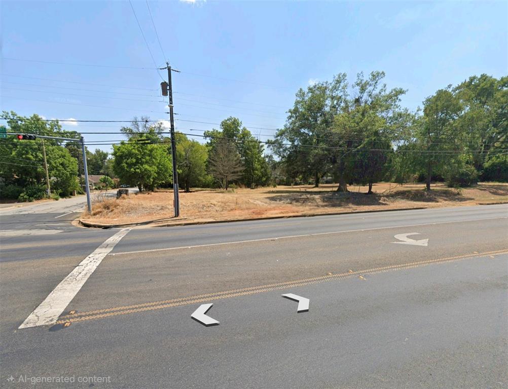 Corner lot featuring mature trees and level topography