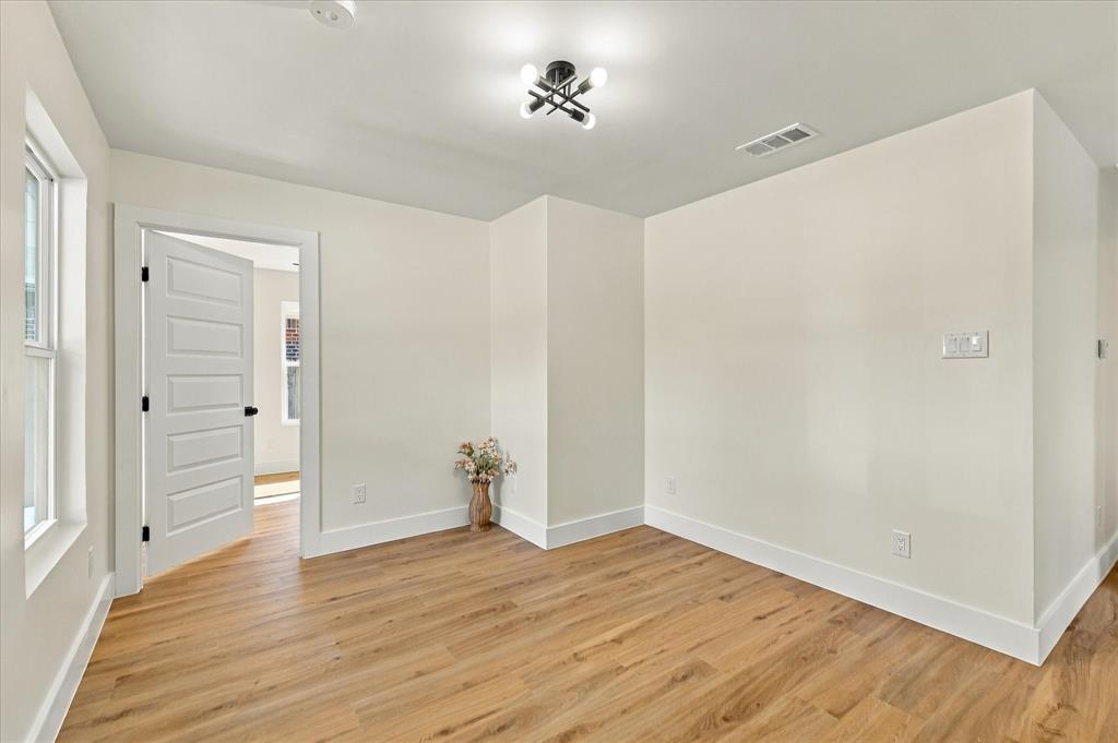 Flex space large enough for an office with access to a secondary bedroom.