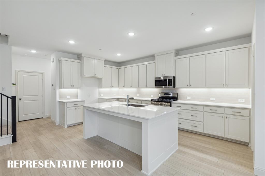 With ample storage and prep space, this kitchen offers everything you have been searching for in a dream kitchen!  REPRESENTATIVE PHOTO