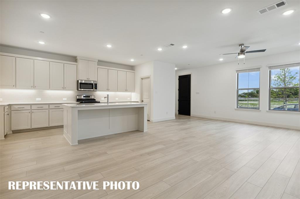 Entertaining is a breeze in this delightful open concept floor plan!  REPRESENTATIVE PHOTO