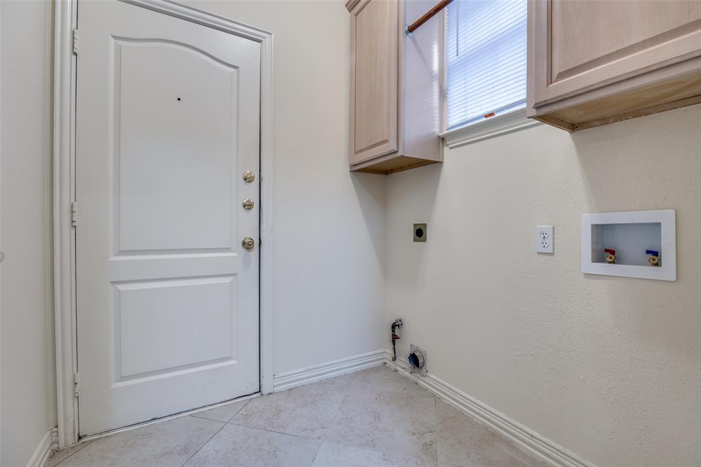 Laundry room full sized washer & dryer area