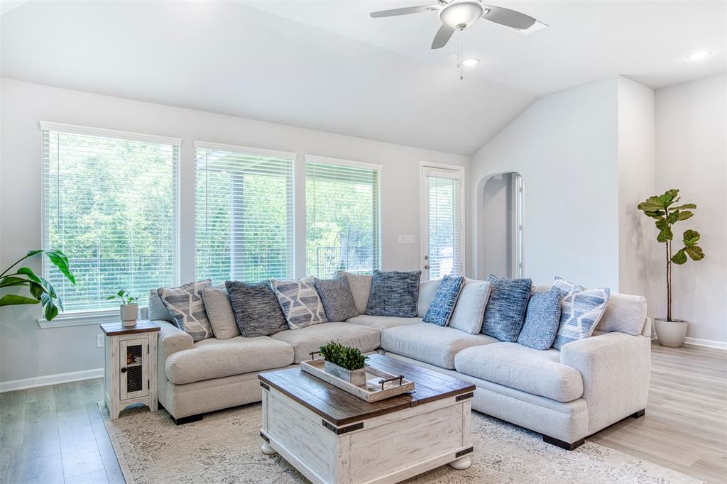Spacious living room flooded by natural light.