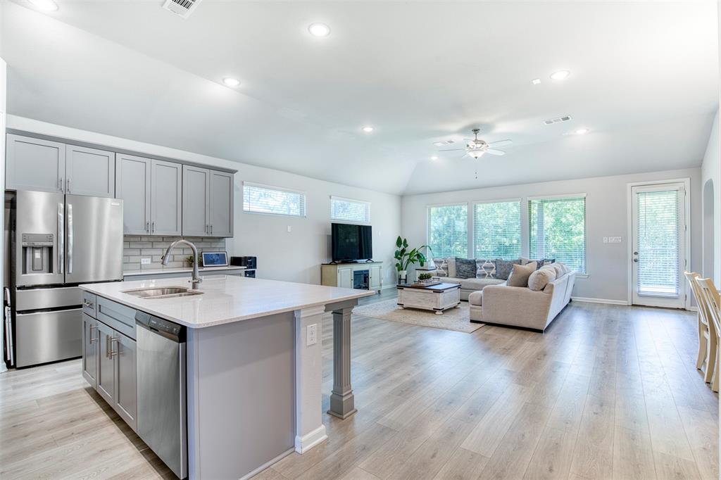 Open-concept floor plan through the heart of the home.