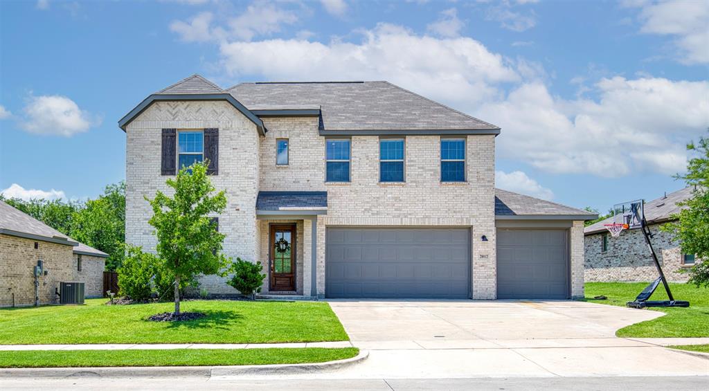 Exterior features large lot, 3 car front entry garage, and covered entry.