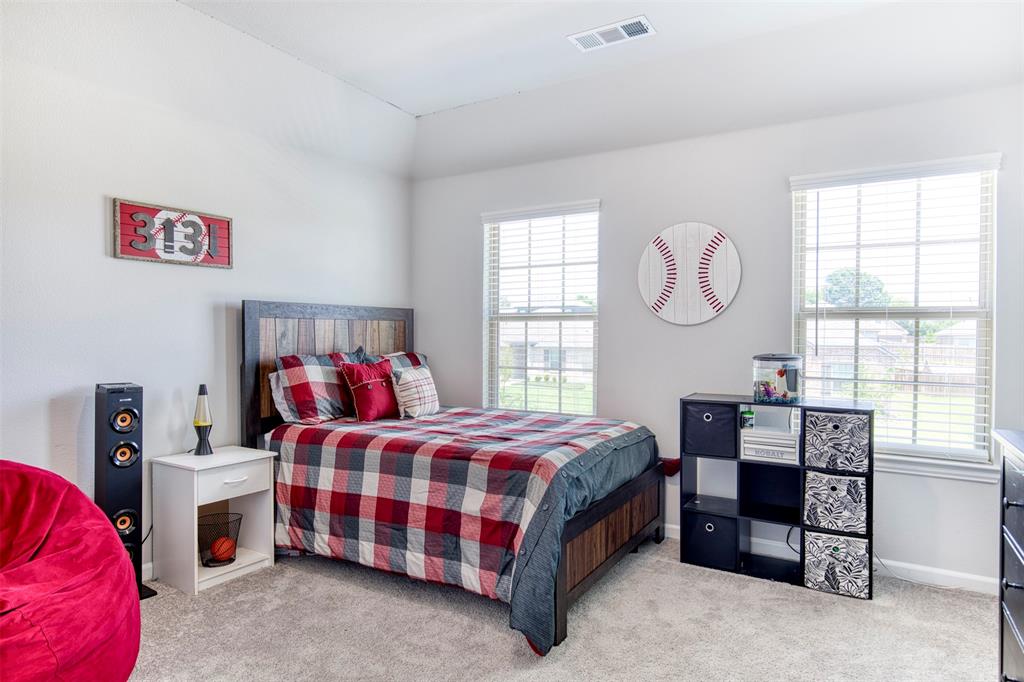Upstairs bedroom with natural light.