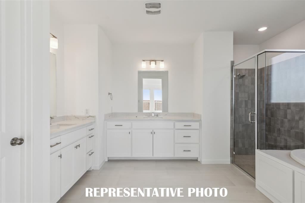 This owner's bath was designed with ample space for two!  REPRESENTATIVE PHOTO
