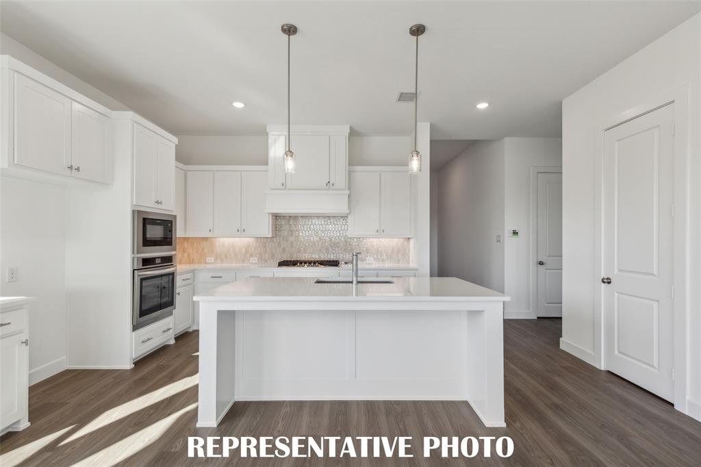 The oversized kitchen island is the hub of your new dream home and the perfect place for friends and family to gather! REPRESENTATIVE PHOTO The oversized kitchen island is the hub of your new dream home and the perfect place for friends and family to gather! REPRESENTATIVE PHOTO