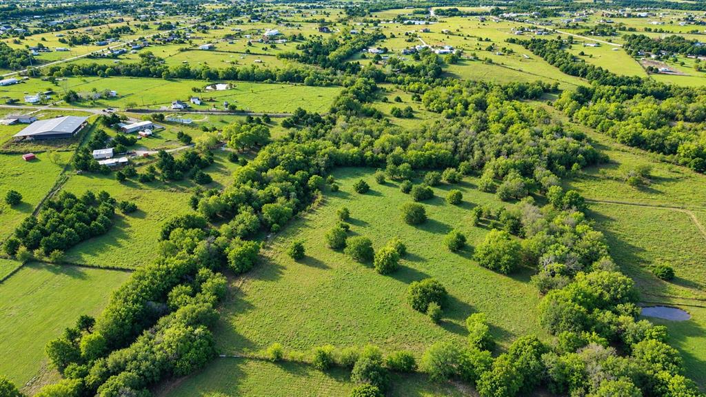 Aerial view showcasing 10.25 acres of opportunity. Aerial view showcasing 10.25 acres of opportunity.