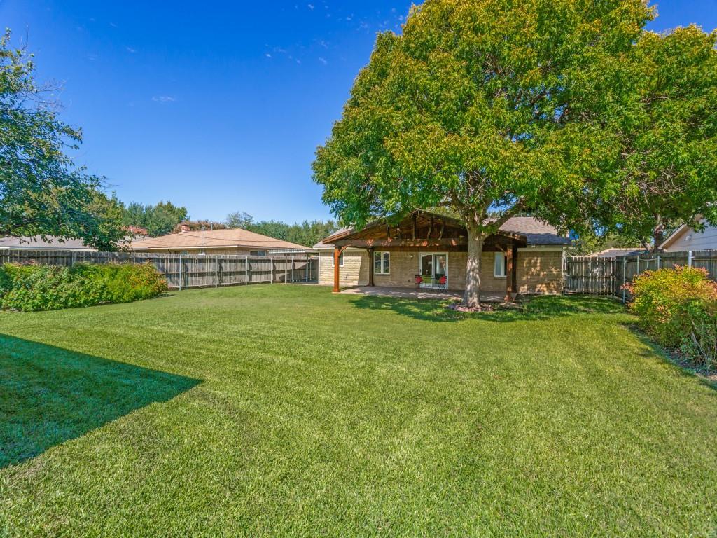 2 garden spaces on each side of big backyard.
