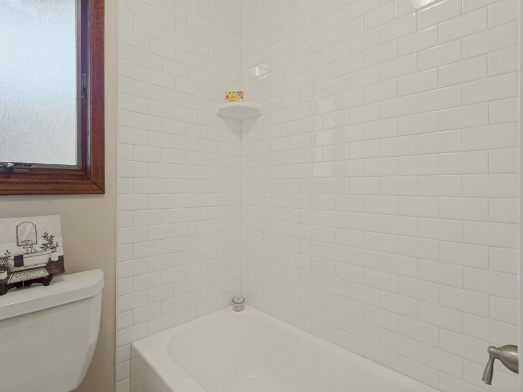 Hall bath tile, tub, toilet updated too.